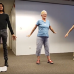 Intergenerational participants rehearse dances in School of Drag workshop.