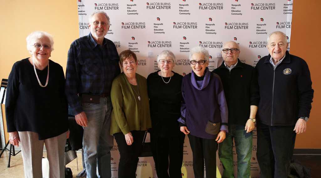 A group of male and female participants pose for a group photo at the Jacob Burns Film Center