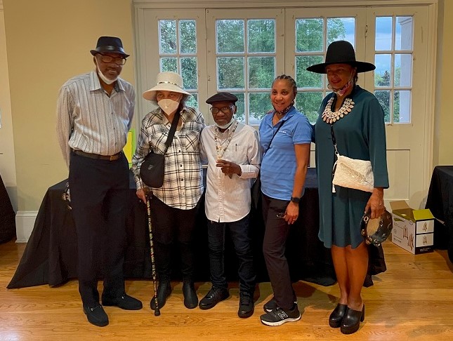 Participants pose with teaching artist, Big Chief Darryl Montana.