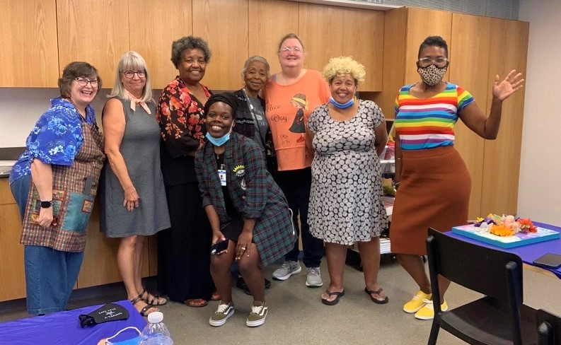 Participants pose with teaching artist, JaBani Bennett.